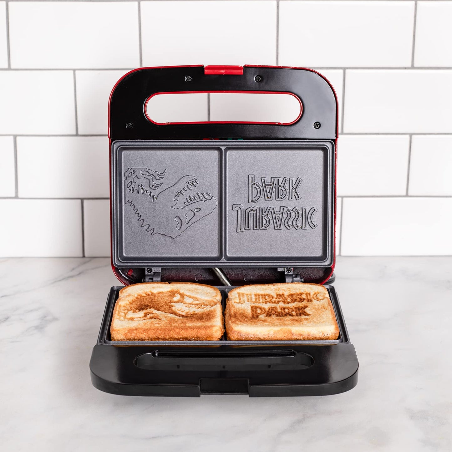 Uncanny Brands Jurassic Park Grilled Cheese Maker- Panini Press and Compact Indoor Grill- Opens 180 Degrees for Burgers