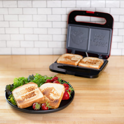 Uncanny Brands Jurassic Park Grilled Cheese Maker- Panini Press and Compact Indoor Grill- Opens 180 Degrees for Burgers