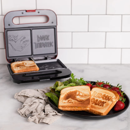 Uncanny Brands Jurassic Park Grilled Cheese Maker- Panini Press and Compact Indoor Grill- Opens 180 Degrees for Burgers