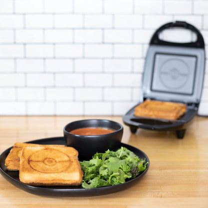 Uncanny Brands Jurassic Park Grilled Cheese Maker- Panini Press and Compact Indoor Grill- Opens 180 Degrees for Burgers